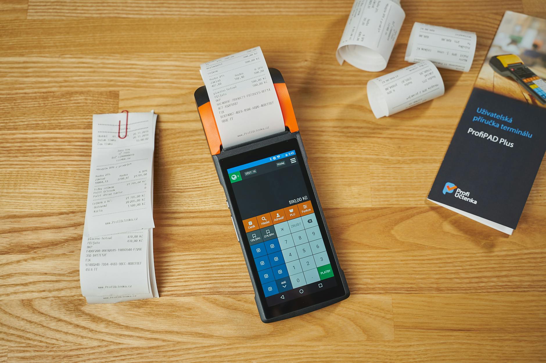 terminal and receipts on a desk